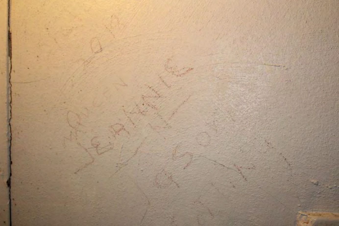 Graffiti left on the C Block dorm wall.