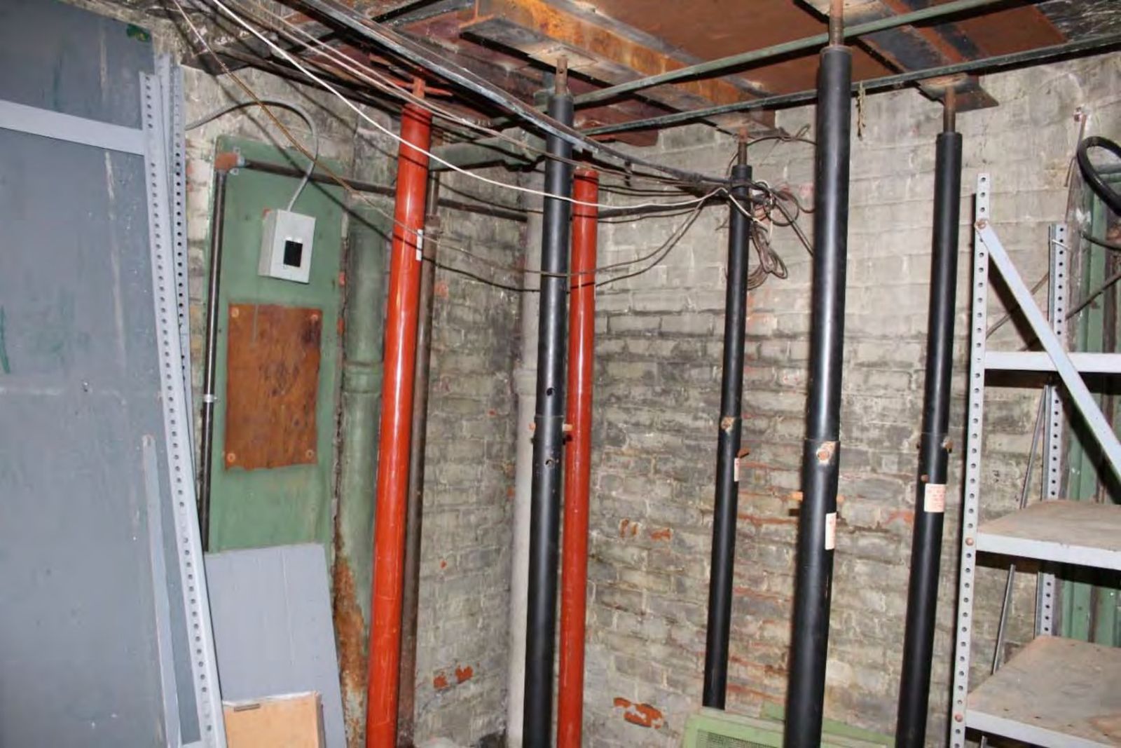 Floor jacks supporting the separating south wall in the basement.