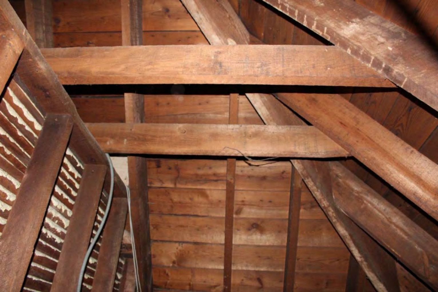Rafters in the unfinished third-floor attic.