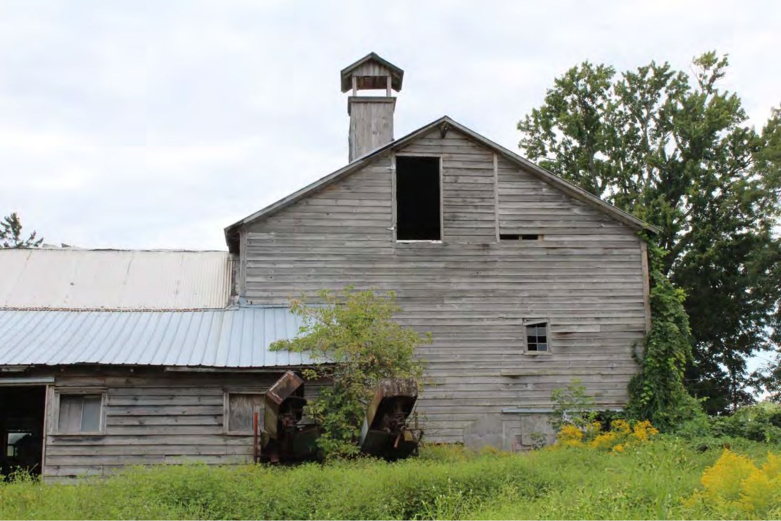 Northern façade of the dairy barn with its distinctive wooden vent.