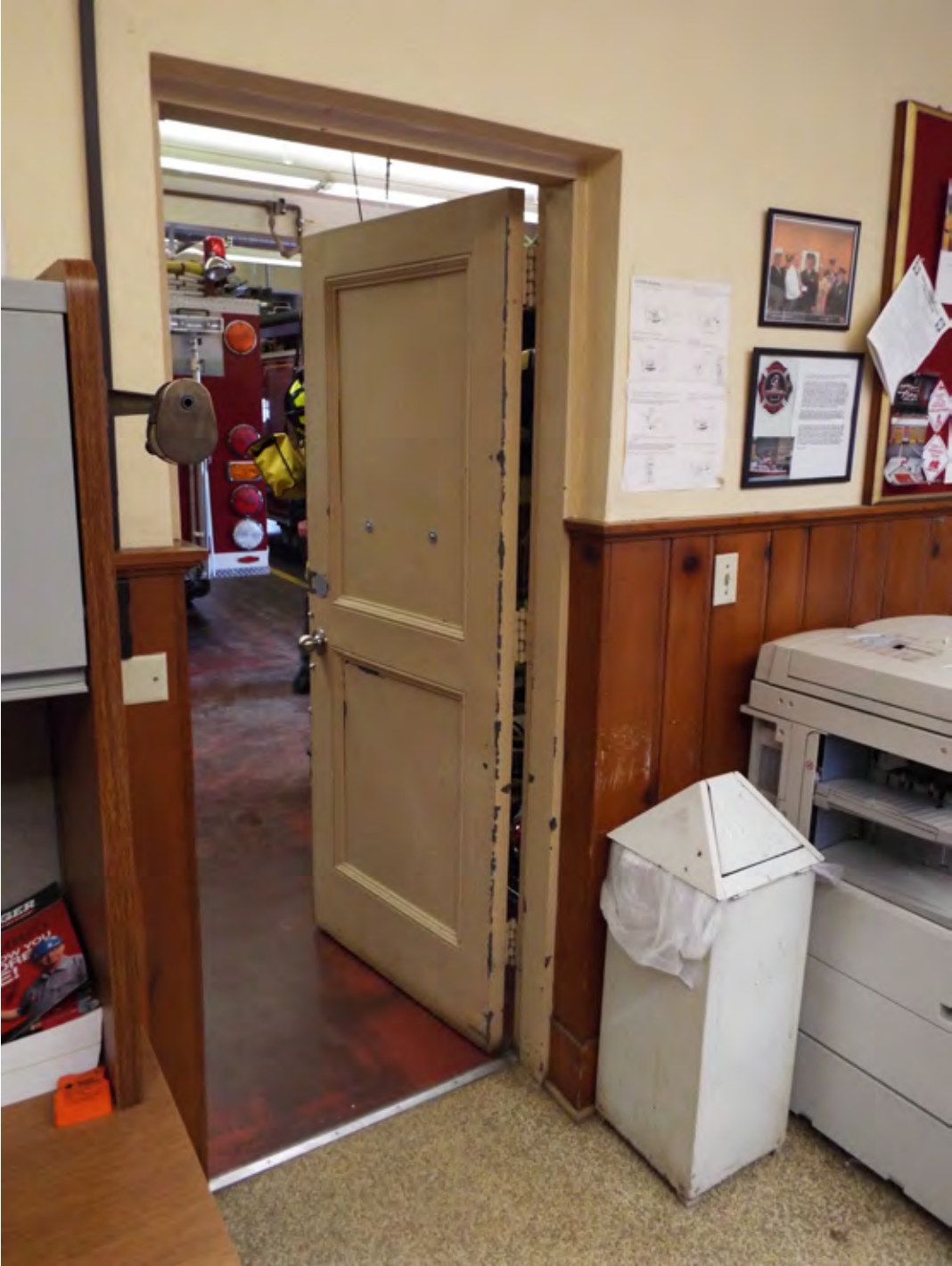 Two-panel door and trim between the garage and break room.